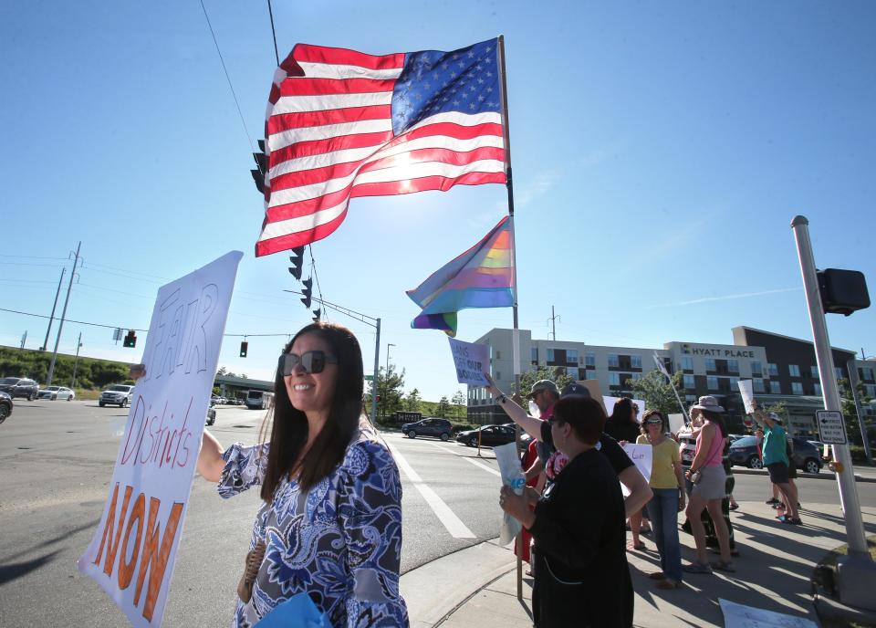 Christine Peterson, left, lets her opinion be known during a protest in Plain Township after the U.S. Supreme Court overturned Roe v. Wade on Friday.