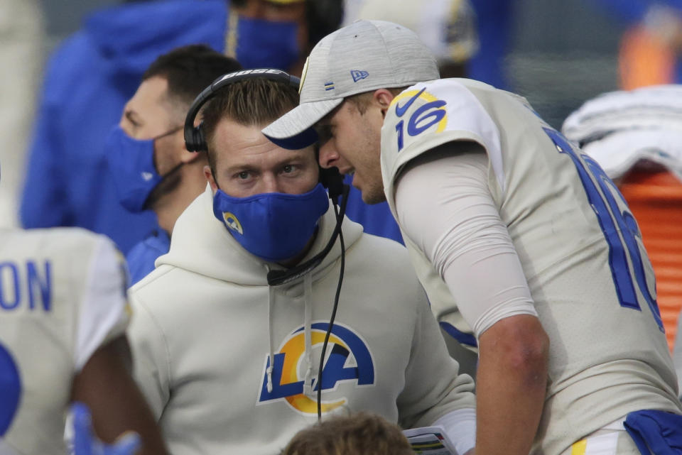FILE - In this Dec. 27, 2020, file photo, Los Angeles Rams quarterback Jared Goff talks with coach Sean McVay on the sideline during the first half of the team's NFL football game against the Seattle Seahawks in Seattle. One after another, quarterbacks once believed to be franchise cornerstones after being top five picks changed addresses this offseason in staggering succession. Matthew Stafford and Goff switched teams in a swap of former No. 1 overall picks. (AP Photo/Scott Eklund, File)