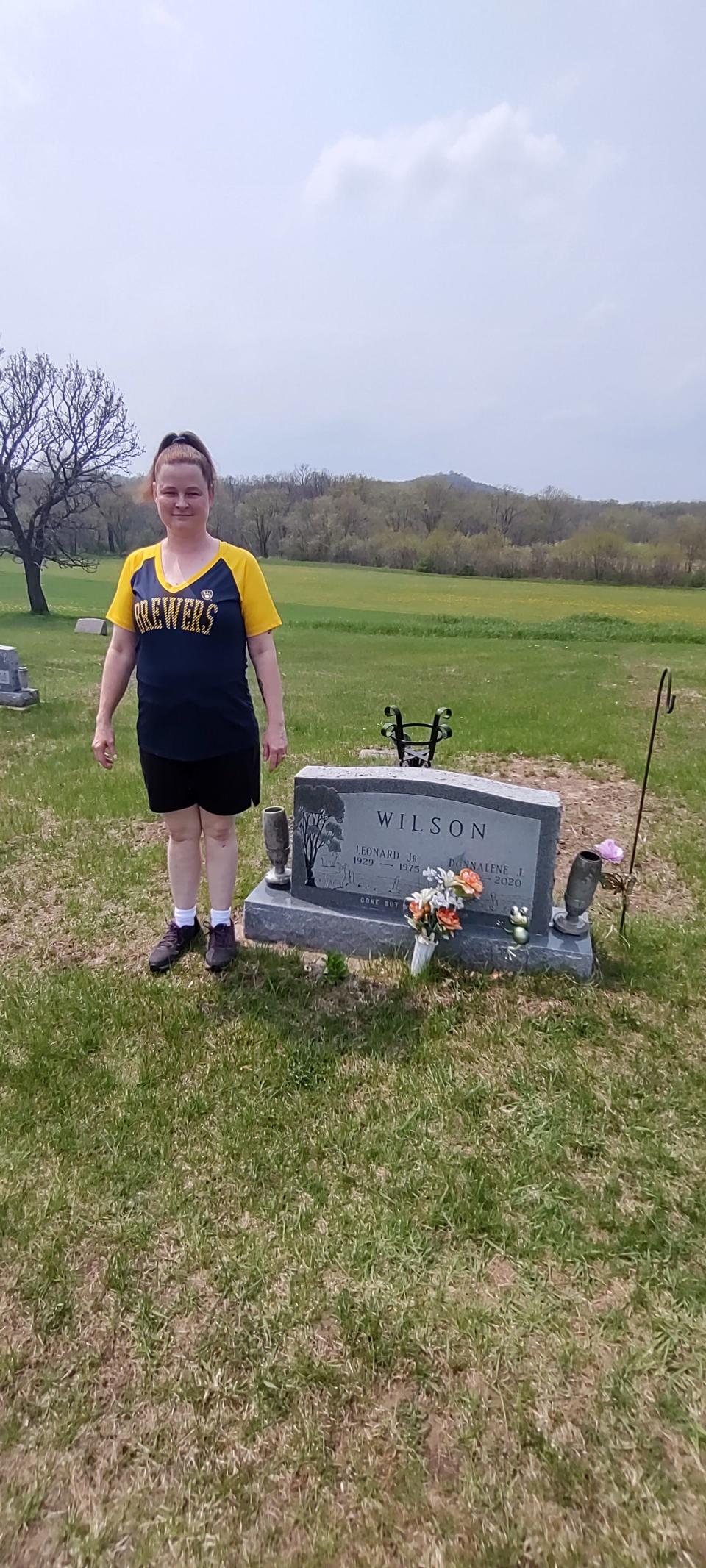 Susan Freeman-Smith with her grandfather's grave in Richland Center, Wisconsin.