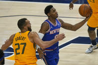 New York Knicks guard RJ Barrett (9) lays the ball up as Utah Jazz center Rudy Gobert (27) defends in the first half during an NBA basketball game Tuesday, Jan. 26, 2021, in Salt Lake City. (AP Photo/Rick Bowmer)