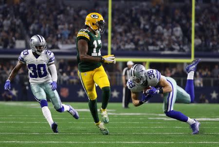 Jan 15, 2017; Arlington, TX, USA; Dallas Cowboys strong safety Jeff Heath (38) makes an interception on a pass intended for Green Bay Packers wide receiver Davante Adams (17) during the third quarter in the NFC Divisional playoff game at AT&T Stadium. Mandatory Credit: Kevin Jairaj-USA TODAY Sports