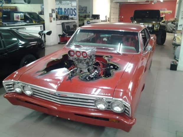 A 1967 Chevelle owned by Maurice Pommerville, a customer of Curtis Customs Radical Garage, is shown after it was returned to him. Pommerville said the garage 'cut the hood all up' and the car was so  damaged he had to sell it for parts. (Submitted by Maurice Pommerville - image credit)