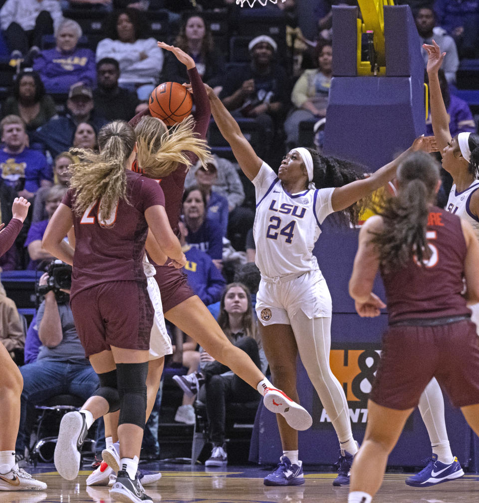 LSU guard Aneesah Morrow (24) blocks the shot attempt of Virginia Tech center Elizabeth Kitley (33) during an NCAA college basketball game Thursday, Nov. 30, 2023, in Baton Rouge, La. (Hilary Scheinuk/The Advocate via AP)