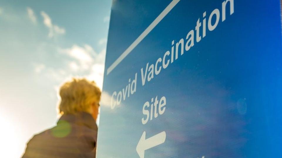 A man entering a new coronavirus vaccination center