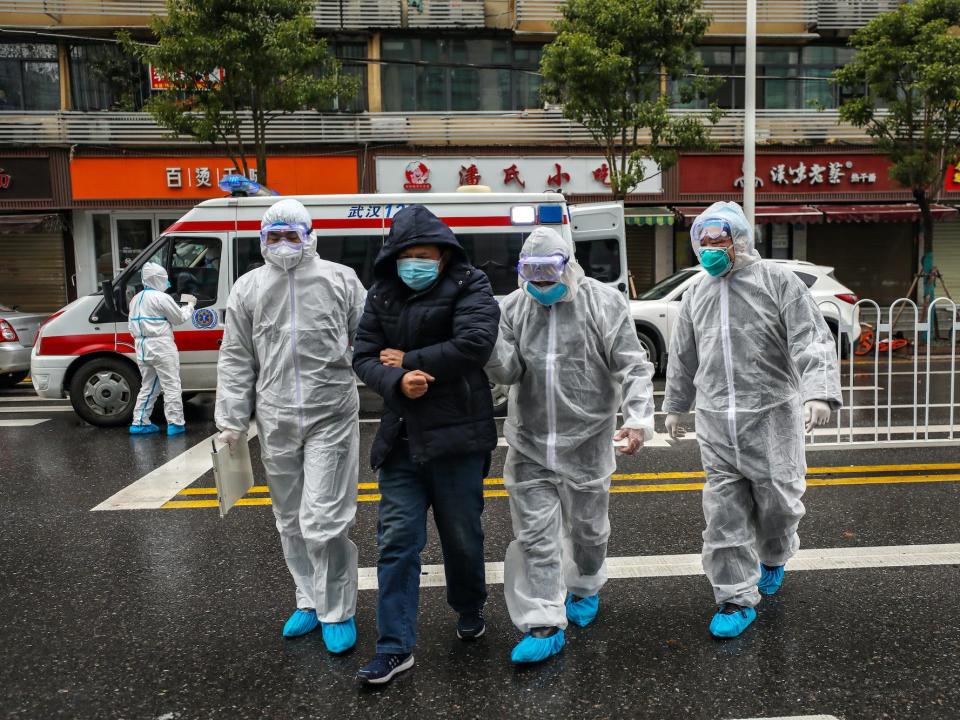 Wuhan China January 26 coronavirus medics help man