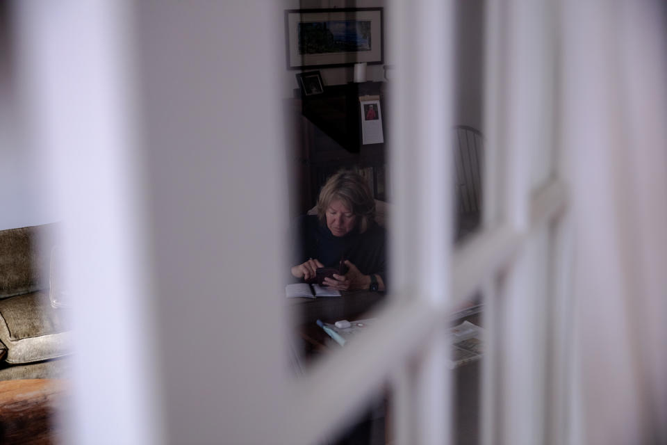 Linda Prine answers calls and texts for the Miscarriage and Abortion Hotline. (Desiree Rios for The Washington Post)