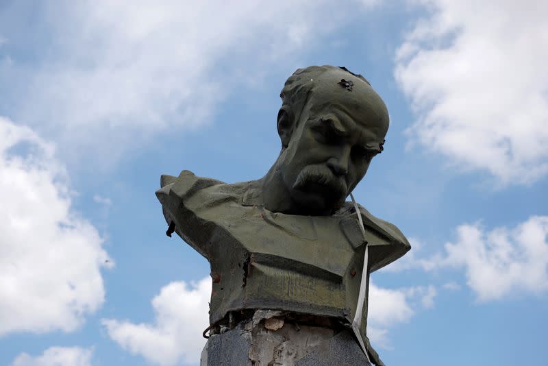 A monument of Ukrainian poet Taras Shevchenko damaged by shelling is pictured in Borodianka