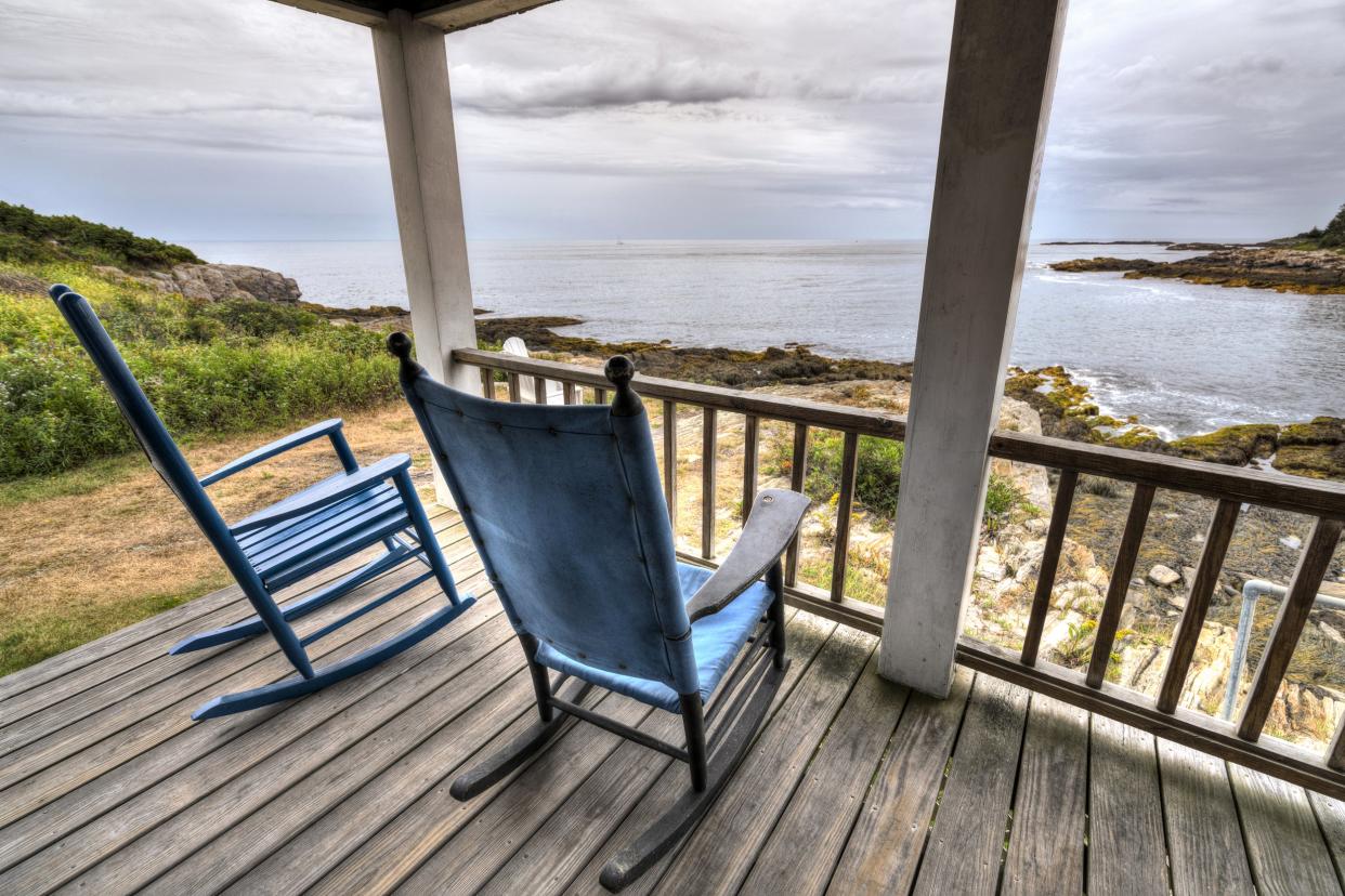 View of front porch of  a secluded cabin on the beach