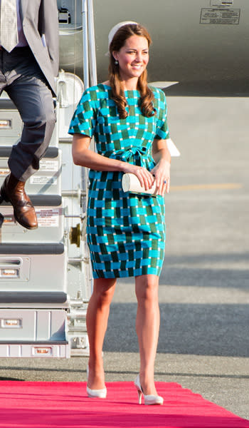 Even when she is disembarking from a plane, Kate still manages to look perfect and polished. Here she is getting off the plane in Honiara, decked out in an aqua geometric print dress by Jonathan Saunders. The printed dress retails for $1,490 on Net-a-Porter. She accessorizes with a clutch bag and her favourite L.K. Bennett pumps. (Photo by Samir Hussein/WireImage)