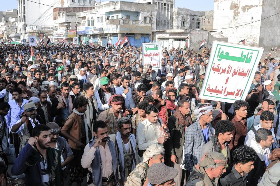 People take to the streets of the Yemeni Red Sea city of Hudeida, to condemn the overnight attacks (AFP via Getty Images)