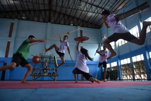 The fighters are part of a growing group of students learning the martial art of "Krabi Krabong"