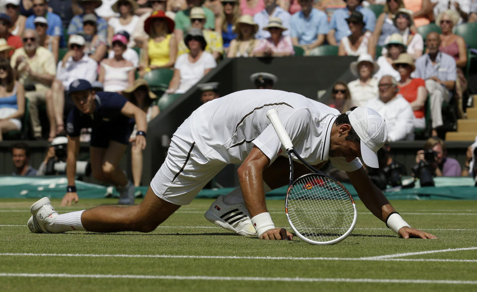 Serbia's Novak Djokovic on the floor in his Men's Final against Great Britain's Andy Murray during day thirteen of the Wimbledon Championships at The All England Lawn Tennis and Croquet Club, Wimbledon.
