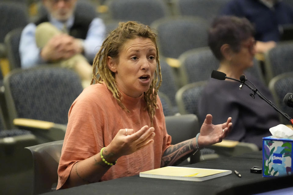 Cara Lamb, ex-wife of shooter Robert Card, testifies, Thursday, May 16, 2024, in Augusta, Maine, during a hearing of the independent commission investigating the law enforcement response to the mass shooting in Lewiston, Maine. (AP Photo/Robert F. Bukaty)