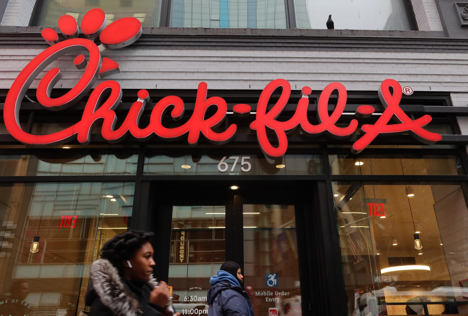 People walk past a Chick-fil-A restaurant on 8th Avenue on December 30, 2023. Photo by Gary Hershorn/Getty Images