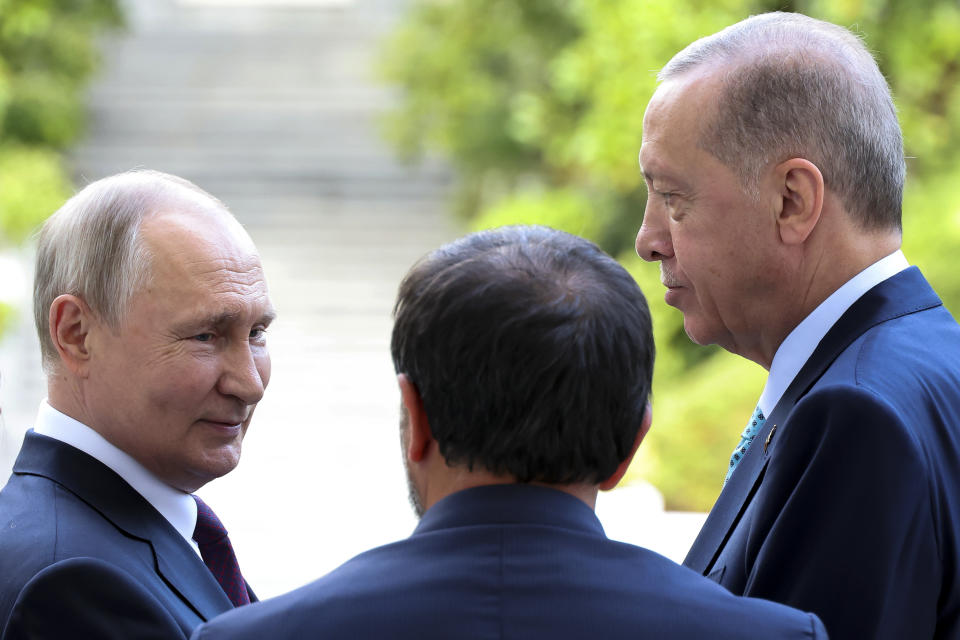 Russian President Vladimir Putin, left, and Turkish President Recep Tayyip Erdogan, right, talk to each other during their talks at Russia's Black Sea resort of Sochi, Russia, Monday, Sept. 4, 2023. (Mikhail Klimentyev, Sputnik, Kremlin Pool Photo via AP)