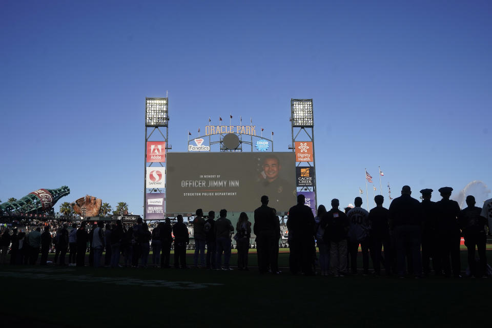 Law enforcement officers killed in the line of duty are honored before a baseball game between the San Francisco Giants and the Arizona Diamondbacks in San Francisco, Monday, July 11, 2022. (AP Photo/Jeff Chiu)