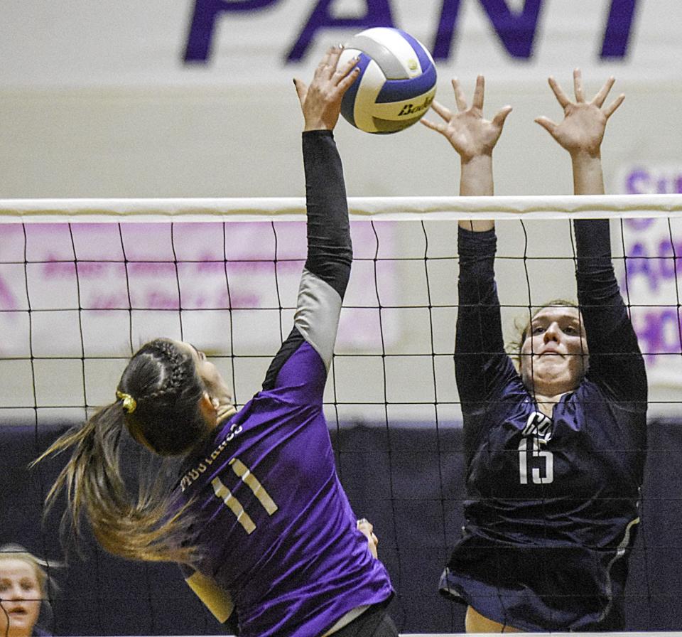 Great Plains Lutheran’s Kendra Schlecht leaps to defend the hit from Waubay-Summit’s Emily Ollerich during a 2018 high school volleyball match in Watertown.