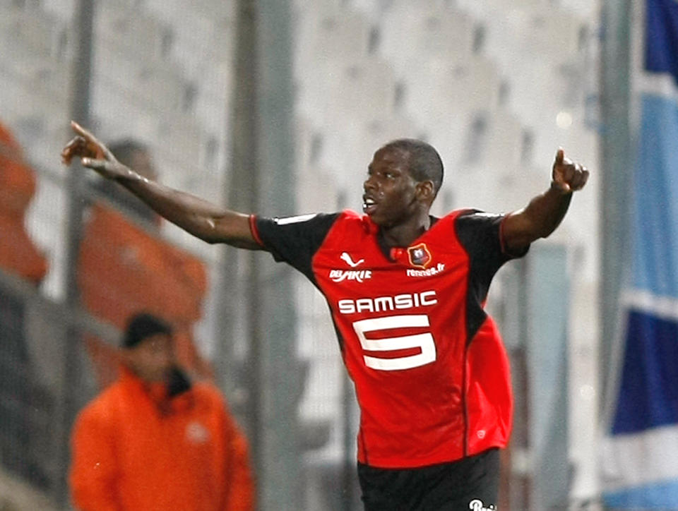 Rennes' Abdoulaye Doucoure celebrates after scoring against Marseille, during their League One soccer match, at the Velodrome Stadium, in Marseille, southern France, Saturday, March 22, 2014. (AP Photo/Claude Paris)