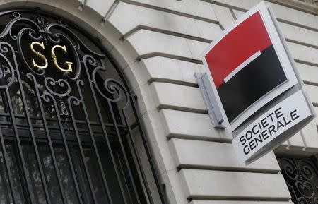 French bank Societe Generale logo is seen on the facade of a building in Paris, November 7, 2013. REUTERS/ Jacky Naegelen