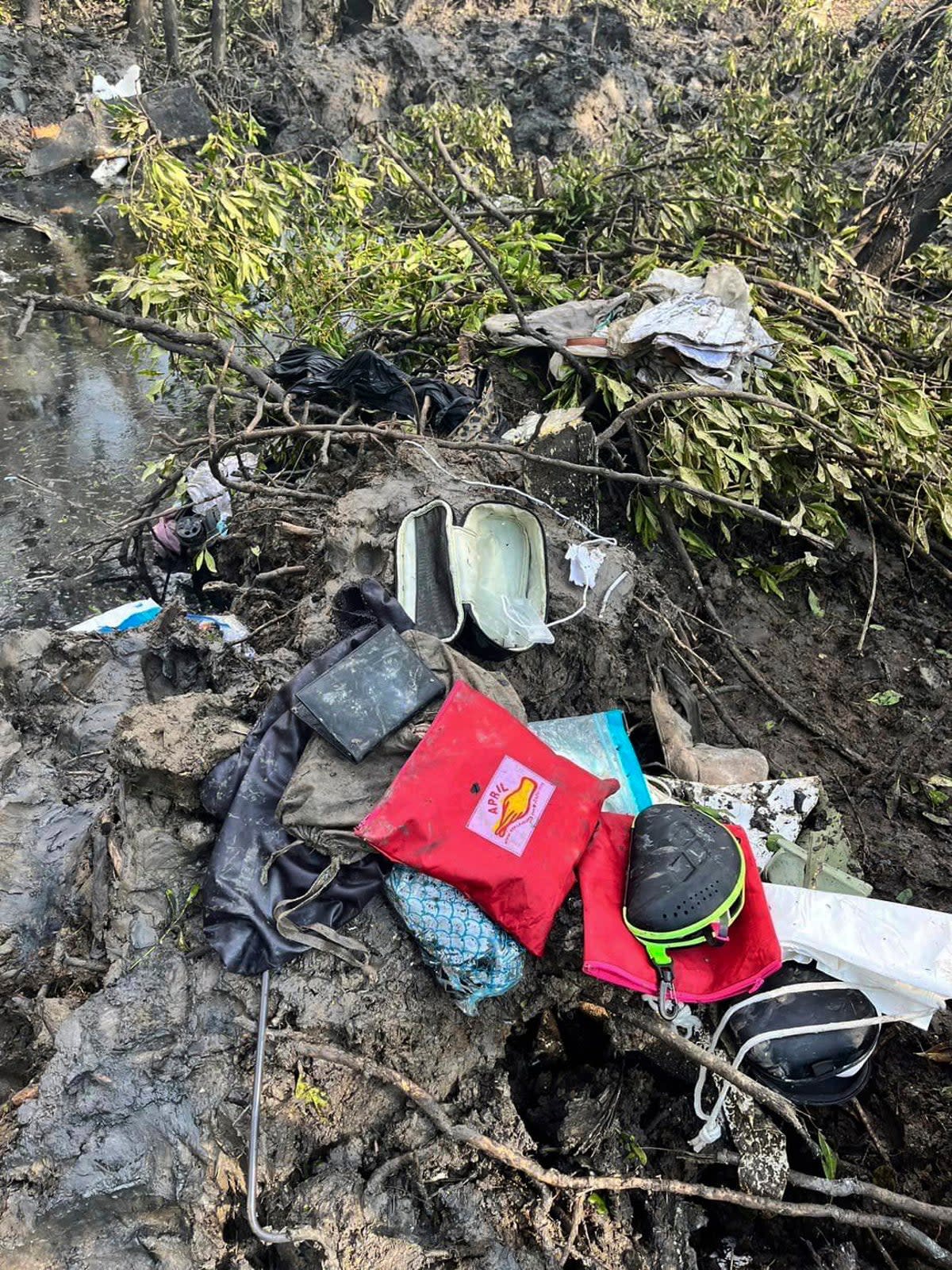 Passengers' belongings are seen at the crash site (AP)