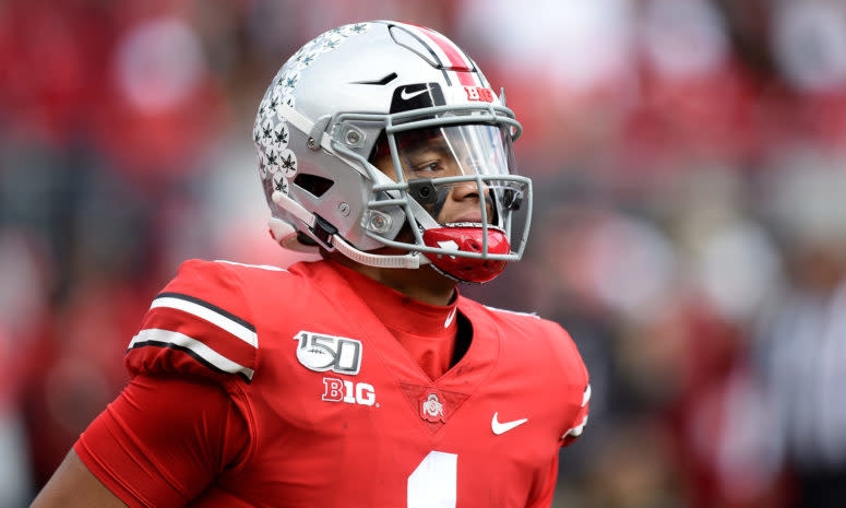 Ohio State football star Justin Fields walks onto the field at Ohio Stadium in Columbus.