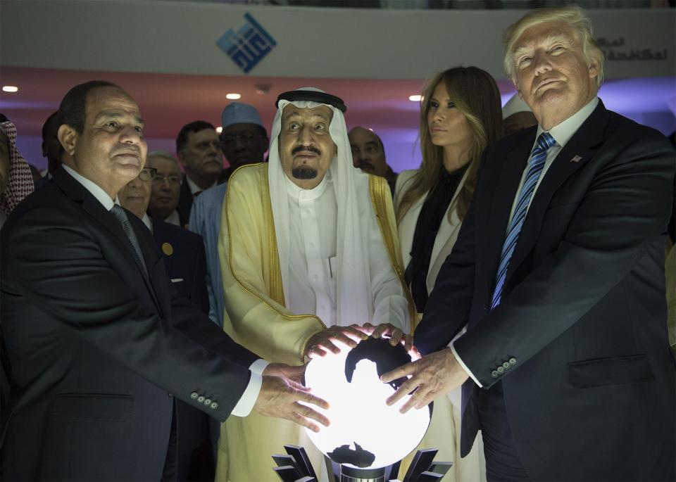 RIYADH, SAUDI ARABIA - MAY 21: (----EDITORIAL USE ONLY  MANDATORY CREDIT - 'BANDAR ALGALOUD / SAUDI ROYAL COUNCIL / HANDOUT' - NO MARKETING NO ADVERTISING CAMPAIGNS - DISTRIBUTED AS A SERVICE TO CLIENTS----)US President Donald Trump, US First lady Melania Trump (2nd R), Saudi Arabia's King Salman bin Abdulaziz al-Saud (2nd L) and Egyptian President Abdel Fattah el-Sisi (L) put their hands on an illuminated globe  during the inauguration ceremony of the Global Center for Combating Extremist Ideology in Riyadh, Saudi Arabia on May 21, 2017. (Photo by Bandar Algaloud / Saudi Royal Council / Handout/Anadolu Agency/Getty Images)