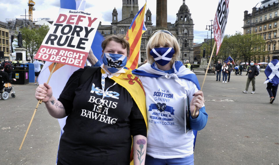 Scottish independence supporters attend a rally in Glasgow, Scotland, Saturday, May 1, 2021. Scotland holds an election Thursday that could hasten the breakup of the United Kingdom. The pro-independence Scottish National Party is leading in the polls and a big victory will give it the the moral right and the political momentum to hold a referendum on whether Scotland should end its three-century union with England. But many voters, even if they support independence, are cautious. (AP Photo/Renee Graham)