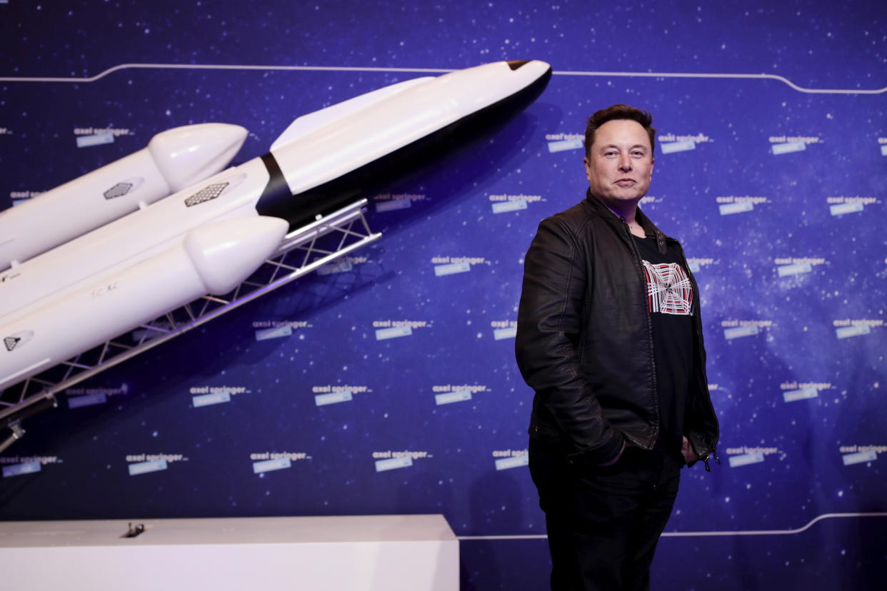 SpaceX owner and Tesla CEO Elon Musk arrives on the red carpet for the Axel Springer media award, in Berlin, Germany, Tuesday, Dec. 1, 2020. (Hannibal Hanschke/Pool via AP)