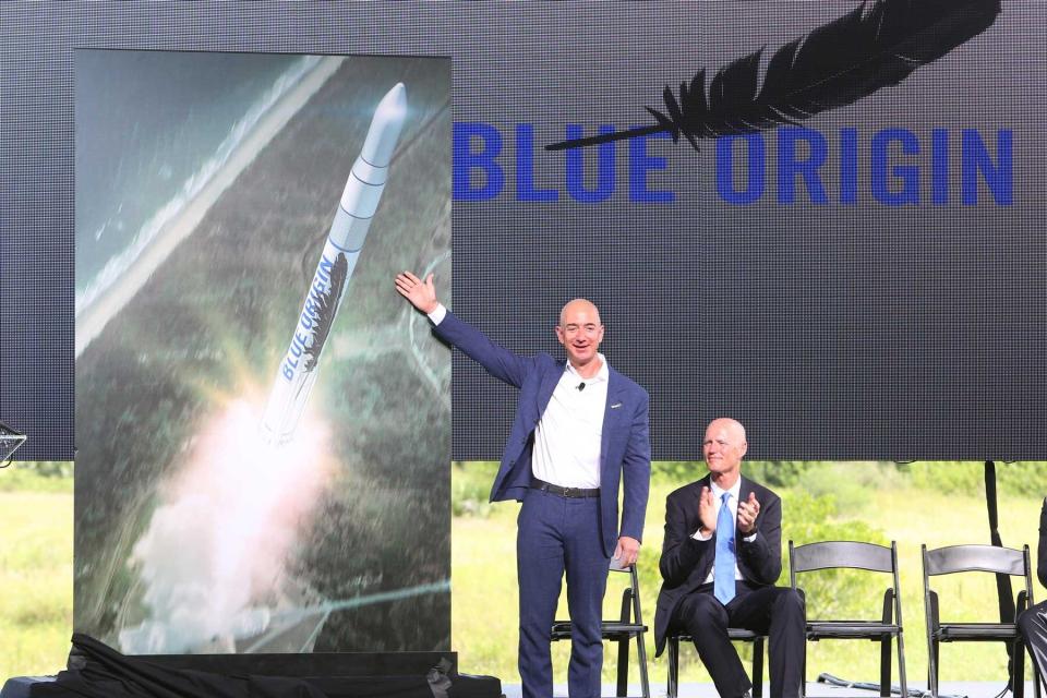 Amazon.com CEO and Blue Origin founder Jeff Bezos, left, debuts a launch vehicle on Tuesday, Sept. 15, 2015