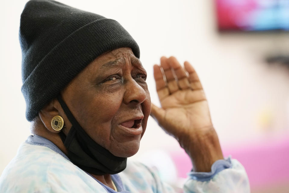 P.M. Browner, 88, speaks about her apprehension over receiving a COVID-19 vaccine while waiting for a transportation bus at the Rev. S.L.A. Jones Activity Center for the Elderly to take her and other seniors to the Aaron E. Henry Community Health Service Center to receive a vaccination, Wednesday, April 7, 2021, in Clarksdale, Miss. The Mississippi Department of Human Services is in the initial stages of teaming up with community senior services statewide to help older residents get vaccinated. (AP Photo/Rogelio V. Solis)