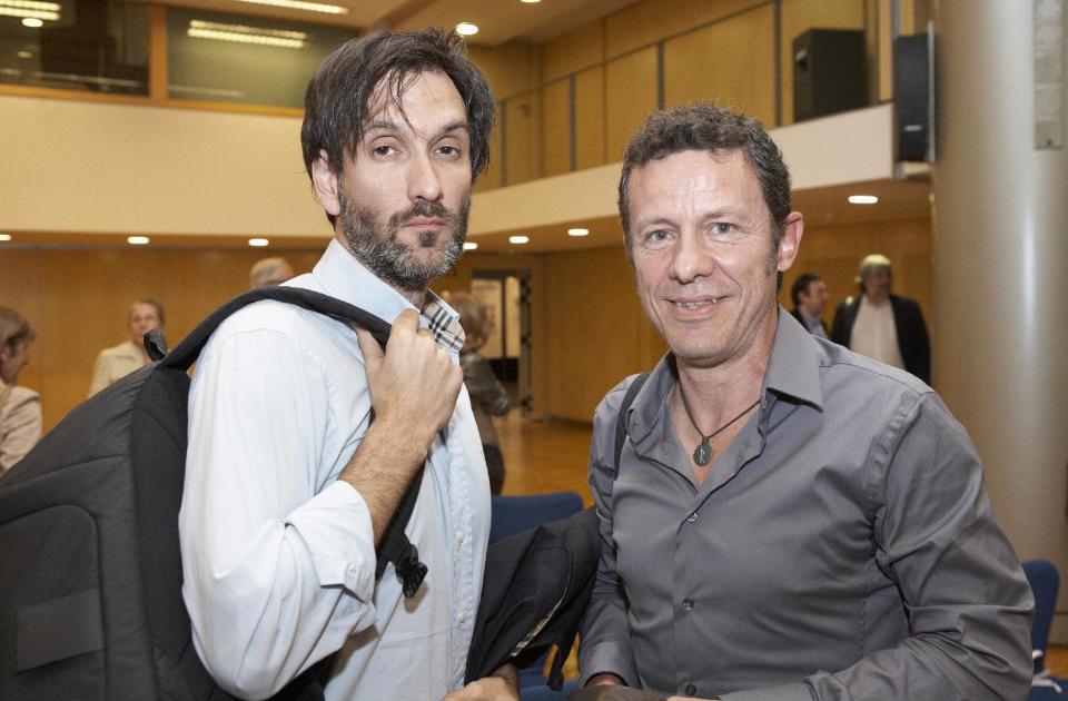 FILE - In this file photo taken on May 24, 2012, Spanish reporters Javier Espinosa, right, and Ricardo Garcia Vilanova, left, pose for a photo during the ceremony of the Miguel Gil journalisms awards in Barcelona, Spain. The two Spanish journalists were freed after being held captive for six months in Syria by a rogue al-Qaida group, the newspaper for which one of the men worked said Sunday March 30, 2014. Espinosa and Vilanova were held since September by the breakaway group, the Islamic State in Iraq and the Levant, who detained them at a checkpoint in the town of Tal Abyad in the eastern province of Raqqa, where the militants dominate. The two were trying to leave Syria at the time. (AP Photo/Joan Borras, file)