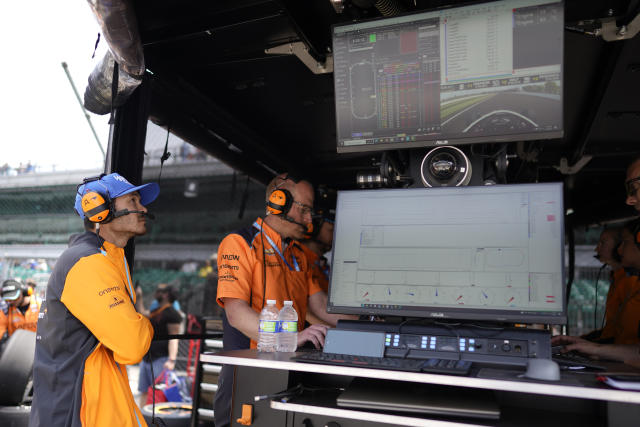 NASCAR's Kyle Larson watches practice for the Indianapolis 500 auto race from an Arrow McLaren pit box at Indianapolis Motor Speedway, Thursday, May 18, 2023, in Indianapolis. Larson announced that he will drive in the 2024 Indianapolis 500. (AP Photo/Darron Cummings)