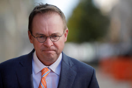 Office of Management and Budget Director Mick Mulvaney leaves the Consumer Financial Protection Bureau (CFPB) building after a meeting in downtown Washington D.C., U.S. November 27, 2017. REUTERS/Carlos Barria