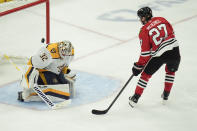 Nashville Predators goaltender Kevin Lankinen stops a breakaway shot from Chicago Blackhawks left wing Lukas Reichel during the third period of an NHL hockey game Friday, April 12, 2024, in Chicago. (AP Photo/Erin Hooley)