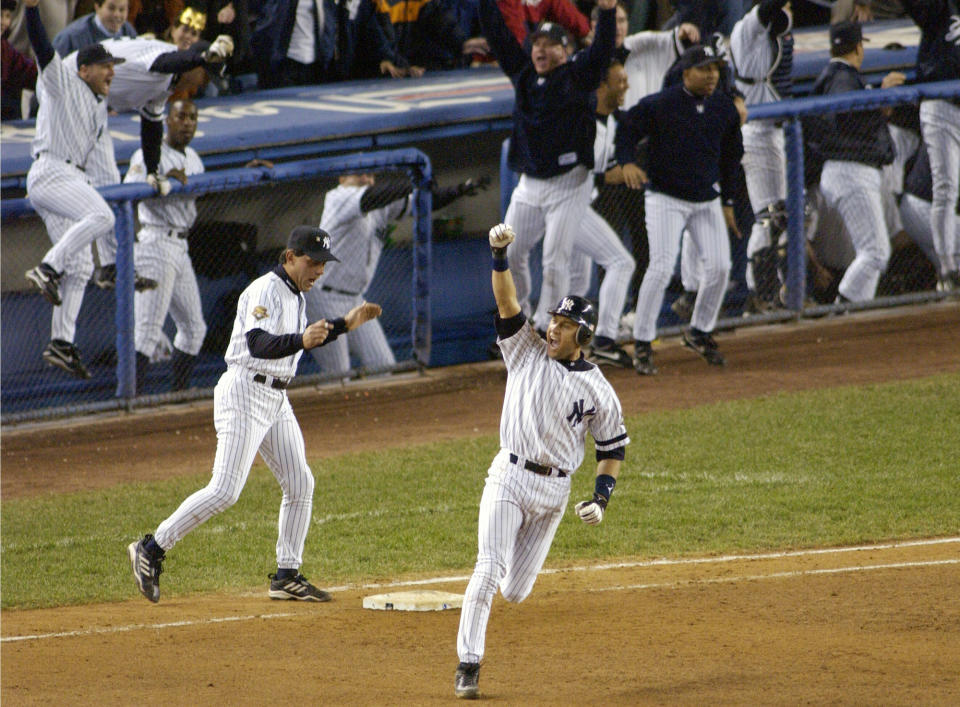 FIEE - In this Oct. 31, 2001, file photo, New York Yankees' Derek Jeter celebrates his game-winning home run in the 10th inning as he rounds first base in Game 4 of baseball's World Series against the Arizona Diamondbacks at Yankee Stadium in New York. Jeter could be a unanimous pick when Baseball Hall of Fame voting is announced Tuesday, Jan. 21, 2020. (AP Photo/Bill Kostroun, File)