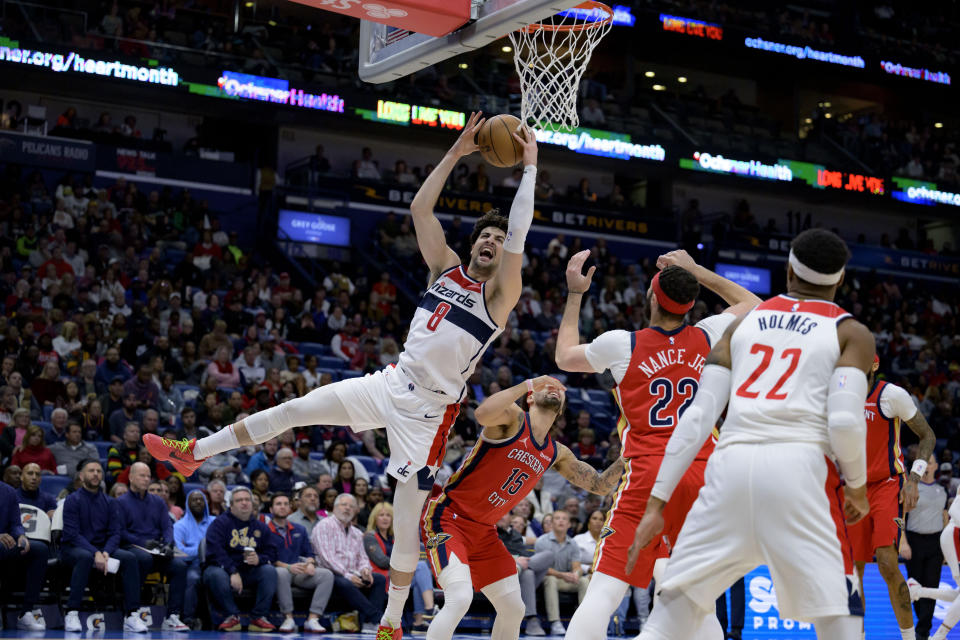 Washington Wizards forward Deni Avdija (8) grabs a rebound against New Orleans Pelicans guard Jose Alvarado (15) during the second half of an NBA basketball game against the Washington Wizards in New Orleans, Wednesday, Feb. 14, 2024. (AP Photo/Matthew Hinton)