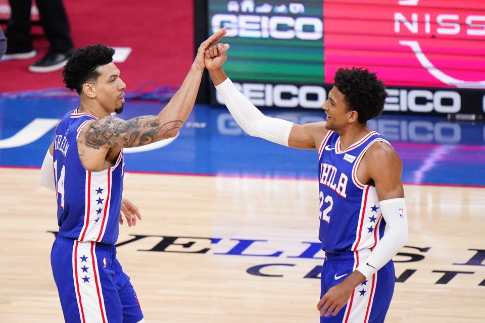 Philadelphia 76ers' Danny Green, left, and Matisse Thybulle celebrate during the first half of an NBA basketball game against the Sacramento Kings, Saturday, March 20, 2021, in Philadelphia. (AP Photo/Matt Slocum)