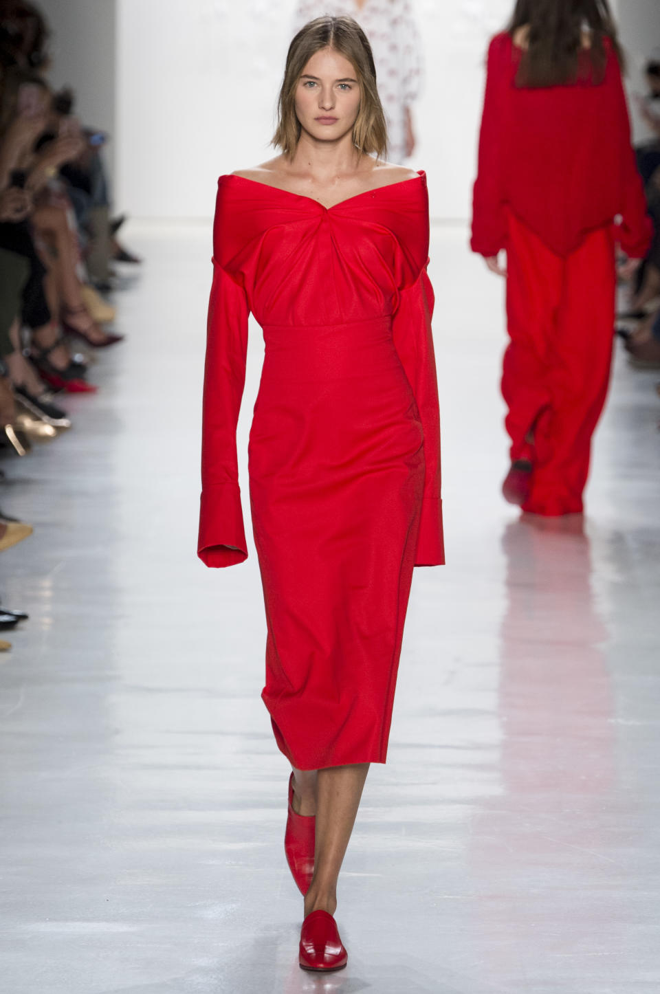 <p><i>Model wears an open-shoulder, crimson-red dress from the SS18 Noon by Noor collection. (Photo: ImaxTree) </i></p>