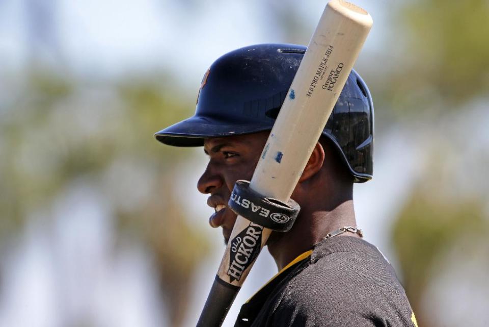 Pittsburgh Pirates' Gregory Polanco waits his turn to face live pitching during the team's baseball spring training workout in Bradenton, Fla., Thursday, Feb. 20, 2014. (AP Photo/Gene J. Puskar)