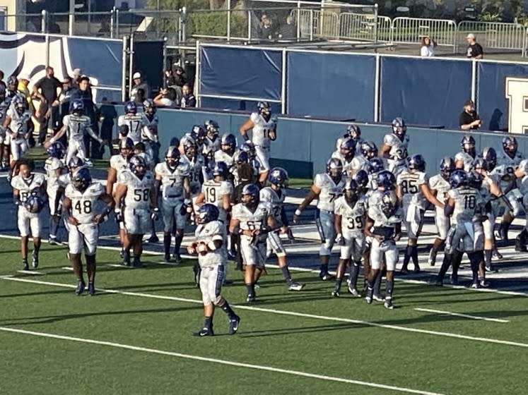 St. John Bosco players wearing their new Nike uniforms for opening game against Miami Central.