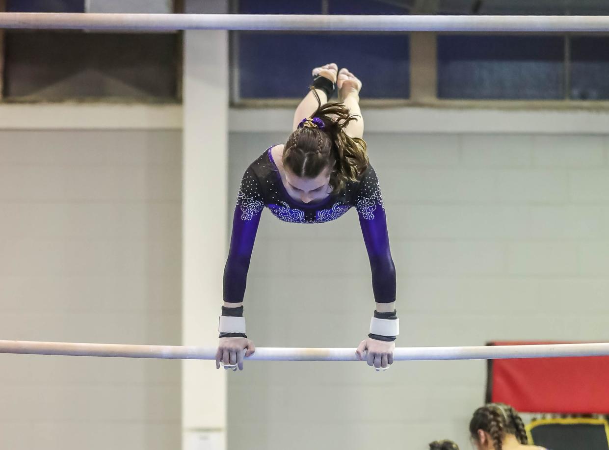 Wylie High School gymnast Chloe McGary performs her routine on the uneven bars at a local competition Jan. 25.
