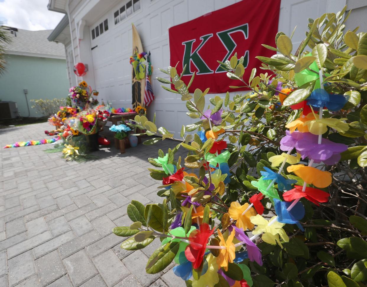 Latitude Margaritaville residents created a makeshift memorial to the late Jimmy Buffett in front of the house the singer-songwriter owned at 197 Island Breeze Ave., Daytona Beach, on Tuesday, Sept. 5, 2023.