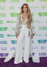 <p>Before taking the stage at the Global Citizen Vax Life Concert, she dazzled in a sexy ivory jumpsuit with silver detailing.</p>