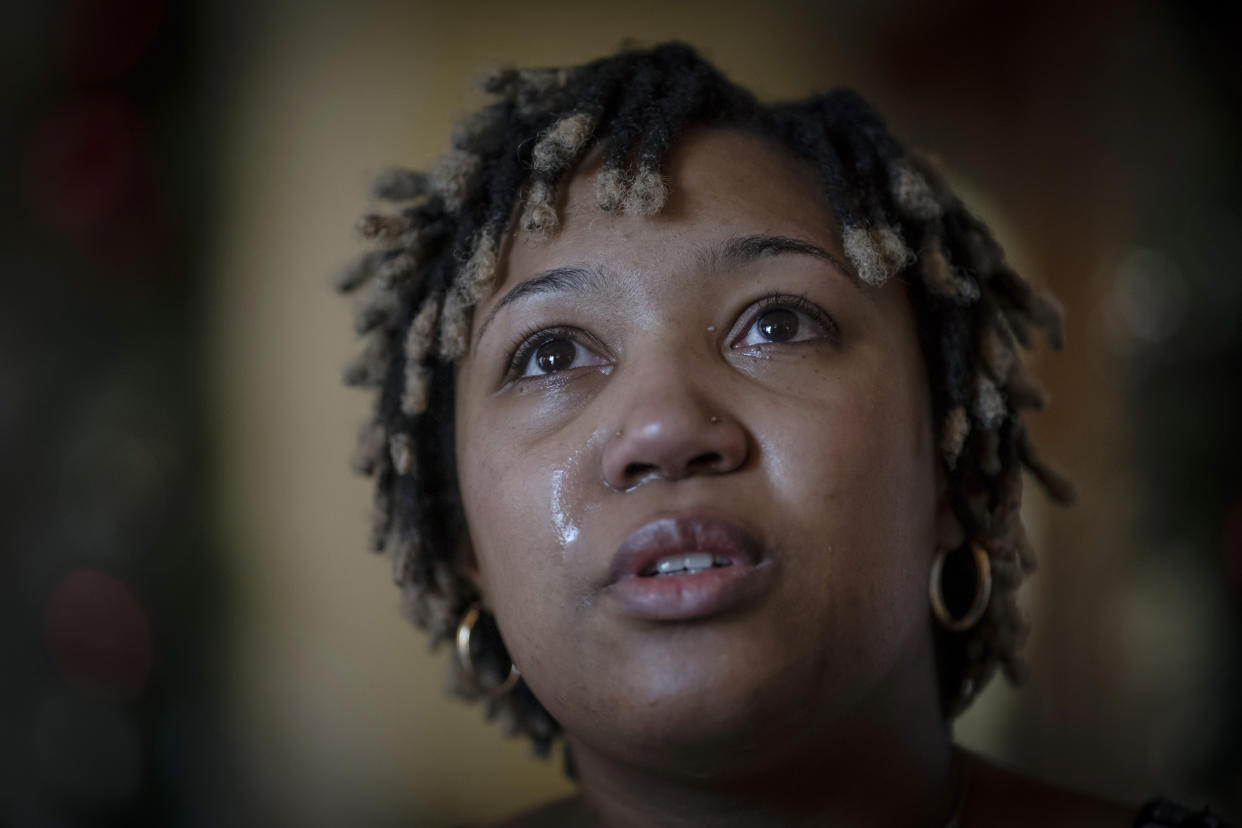 Angelica Lyons tears up while recalling her birthing experience during an interview in Birmingham, Ala. (AP Photo/Wong Maye-E)