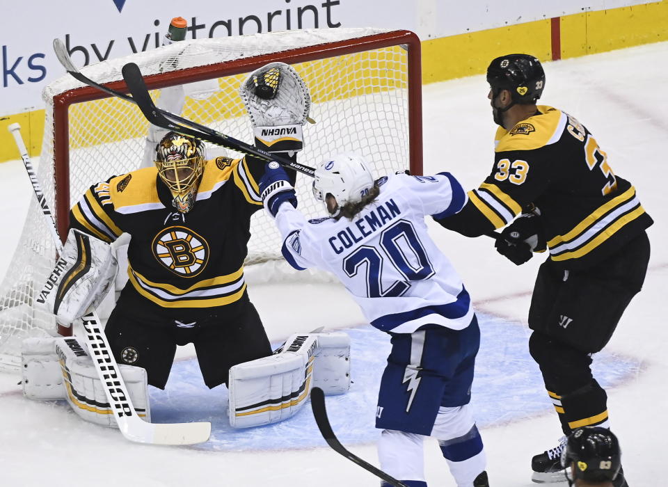 Boston Bruins goaltender Tuukka Rask (40) makes a glove save as Tampa Bay Lightning center Blake Coleman (20) and Bruins defenseman Zdeno Chara (33) look on during the second period of an NHL Stanley Cup playoff hockey game in Toronto, Ontario, Wednesday, Aug. 5, 2020. (Nathan Denette/The Canadian Press via AP)