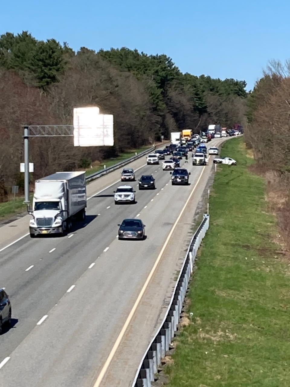 A Lexus that state police described as stolen sits along the side of Interstate 290 in Northborough on Monday.