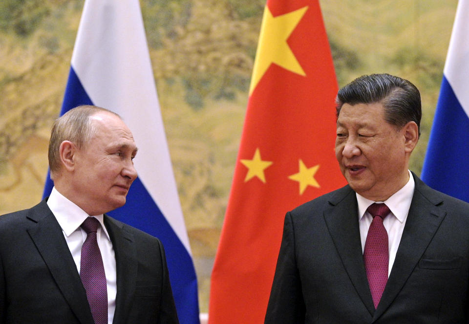 Chinese President Xi Jinping, right, and Russian President Vladimir Putin talk to each other during their meeting in Beijing, China, February 4, 2022. / Credit: Alexei Druzhinin/Sputnik/Kremlin Pool Photo/AP