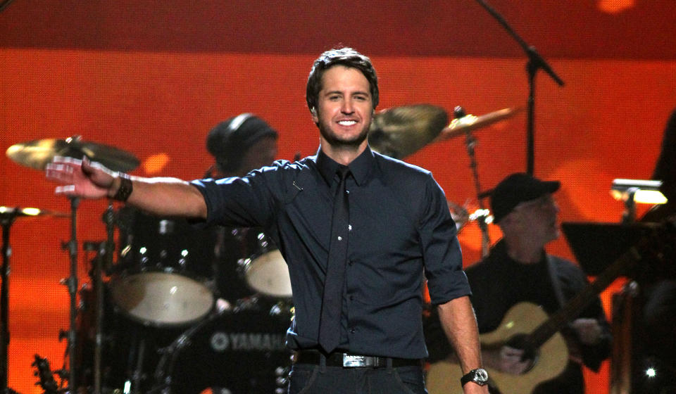 FILE - In this April 2, 2012 file photo, Luke Bryan performs "Running with the Night" at ACM Presents: Lionel Richie and Friends in Concert in Las Vegas. Luke Bryan leads the 2012 American Country Awards nominees with seven nominations; Lady Antebellum and Zac Brown Band each earned six nods; and Eric Church and Taylor Swift garnered five nominations. The American Country Awards will air live from Mandalay Bay in Las Vegas Monday, Dec. 10, 2012 (8:00-10:00 PM ET live/PT tape-delayed) on FOX. (AP Photo/Jeff Bottari, File)