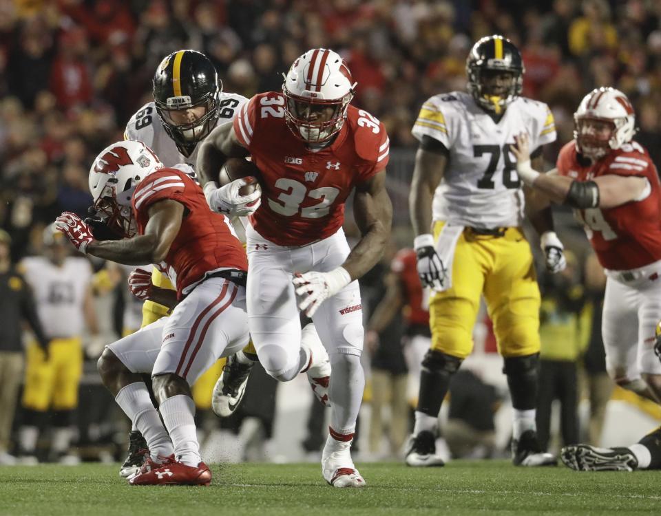 Wisconsin’s Leon Jacobs runs back a fumble for a touchdown during the second half of an NCAA college football game against Iowa Saturday, Nov. 11, 2017, in Madison, Wis. (AP Photo/Morry Gash)
