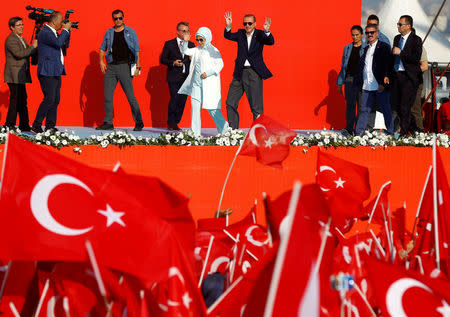 Turkish President Tayyip Erdogan and his wife Emine Erdogan attend Democracy and Martyrs Rally, organized by him and supported by ruling AK Party (AKP), oppositions Republican People's Party (CHP) and Nationalist Movement Party (MHP), to protest against last month's failed military coup attempt, in Istanbul, Turkey, August 7, 2016. REUTERS/Osman Orsal/File Photo